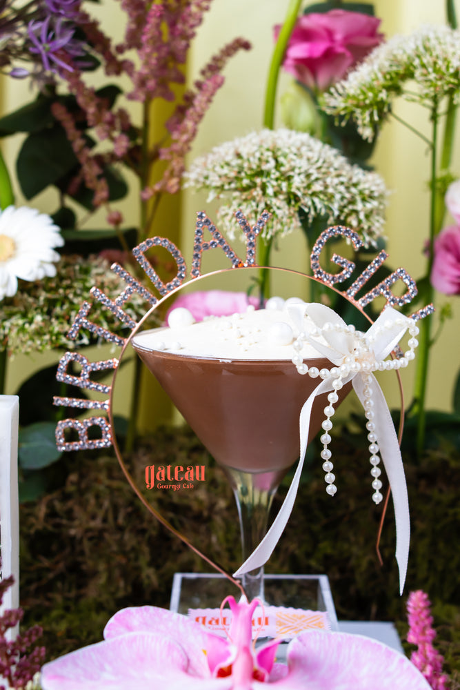 Floral birthday cake design from Gateau Gourmet Cafe with elegant decorations and cheerful colors