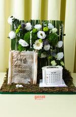 Floral cake designs for summer by Gateau Gourmet Cafe featuring white flowers and green moss details