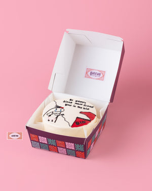 Flork cake custom design by Gateau Gourmet Cafe in a decorative purple and floral box on a pink background