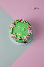 Flower Crown Cake for Mom with green frosting and pink flowers from Gateau Gourmet Cafe