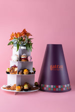 Flower themed tea set gift with assorted cakes and pastries in a tiered stand by Gateau Gourmet Cafe