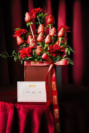 Elegant bouquet of Fresh Strawberry Dipped in Chocolate arranged with red flowers at Gateau Gourmet Cafe