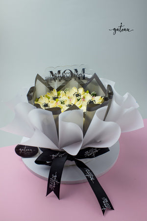 Beautiful White & Black Flowers in Bloom Cake Bouquet elegantly decorated for special celebrations