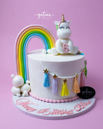 Fun lol-candy-theme-cake featuring a unicorn, rainbow, and colorful decorations for birthdays