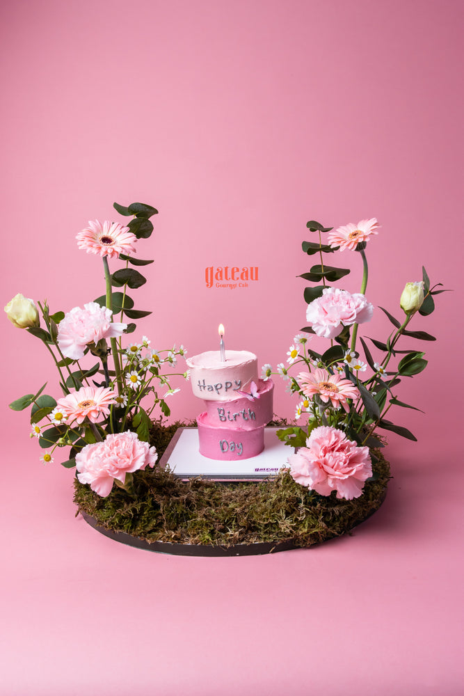 3 Layers Nano Cake with Candle decorated with pink flowers on a moss base by Gateau Gourmet Cafe