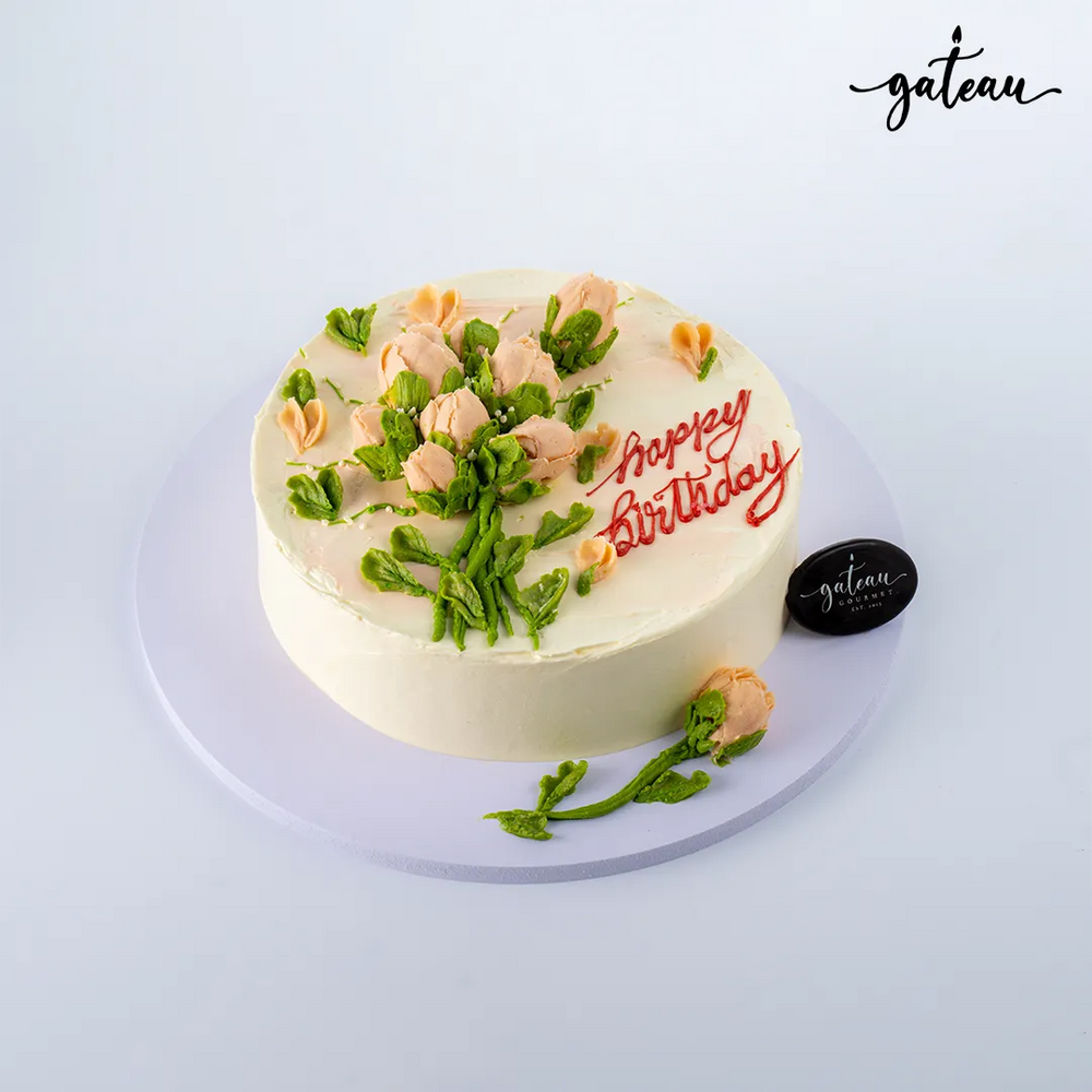 Delicious birthday cake decorated with baby-rose-bundle and colorful icing for celebration