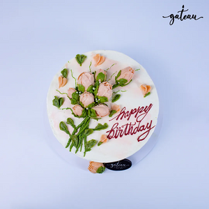 Beautiful baby-rose-bundle birthday cake with floral decorations and a cheerful message