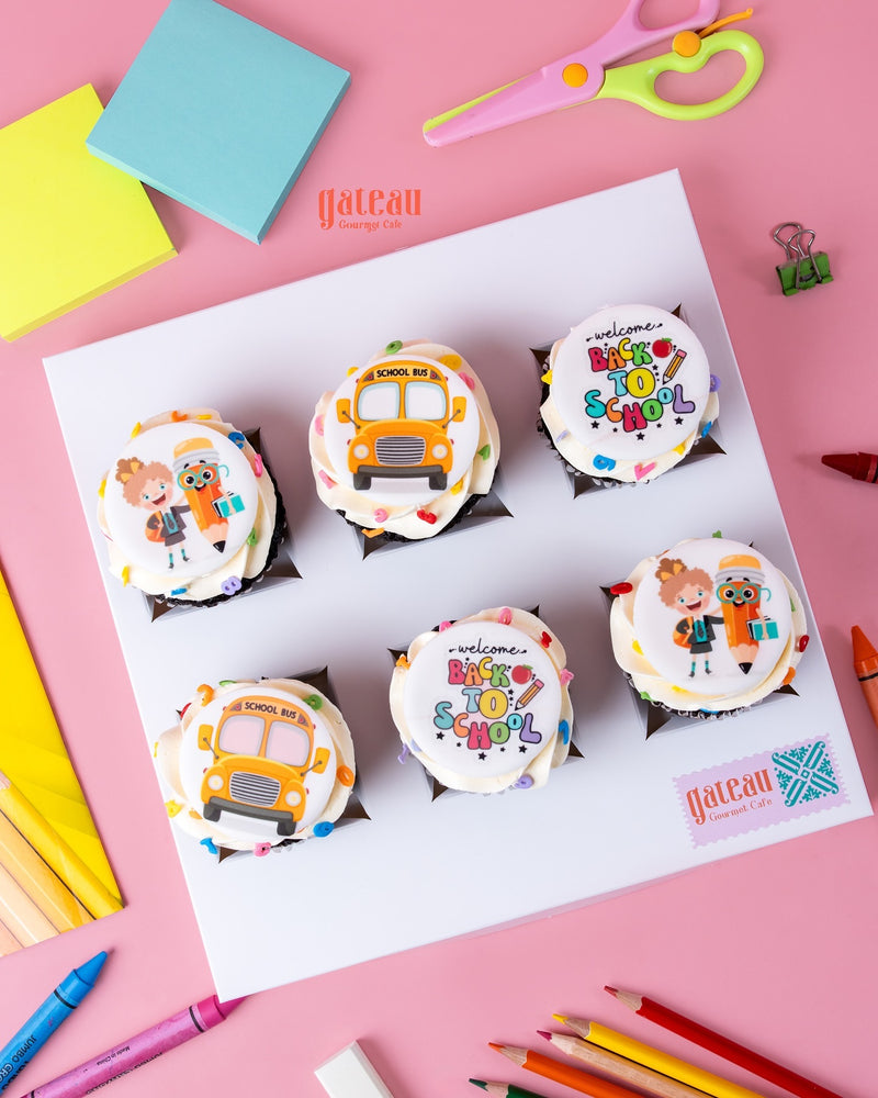 Back to school cupcakes by Gateau Gourmet Cafe featuring colorful school bus and welcome designs