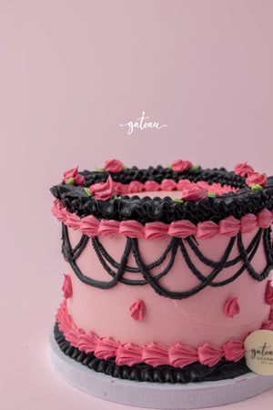 Barbie theme cake for birthdays with pink and black decorative frosting from Gateau Gourmet Cafe