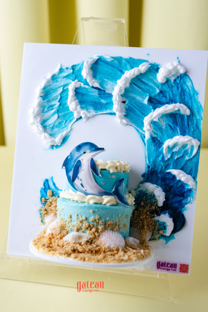 Beach themed birthday cake by Gateau Gourmet Cafe with blue waves dolphin and sand decoration