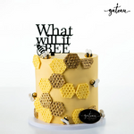 Bee themed gender reveal cake decorated with honeycomb patterns and a playful sign saying What will it bee