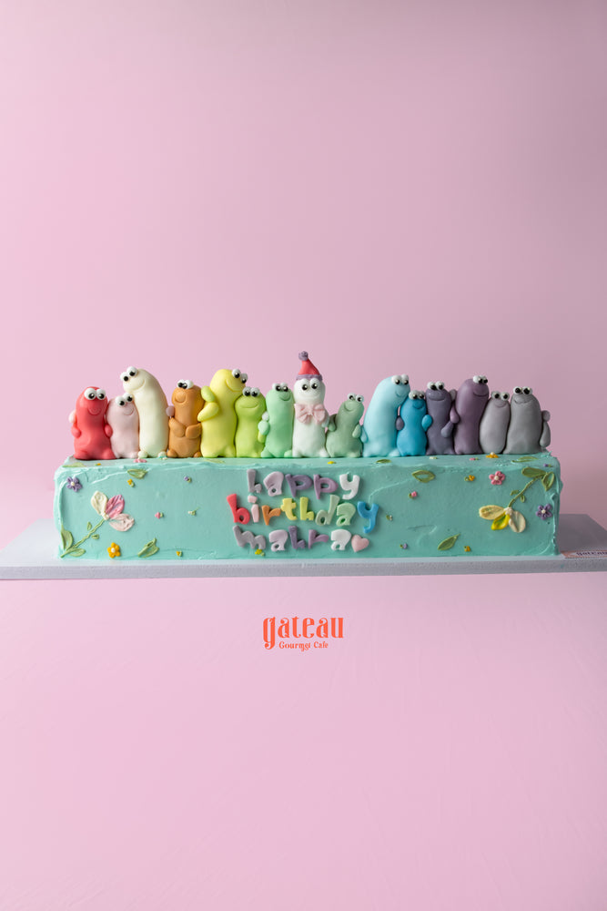 Colorful birthday cake for best friend decorated with playful gummy characters and floral designs