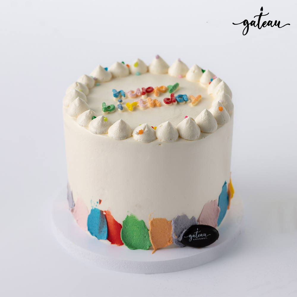 Colorful birthday cake from Gateau Gourmet Cafe with sprinkles for birthday cakes delivery
