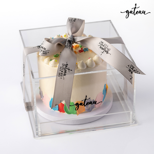 Delicious birthday cake from Gateau Gourmet Cafe in a clear box, perfect for birthday cakes delivery