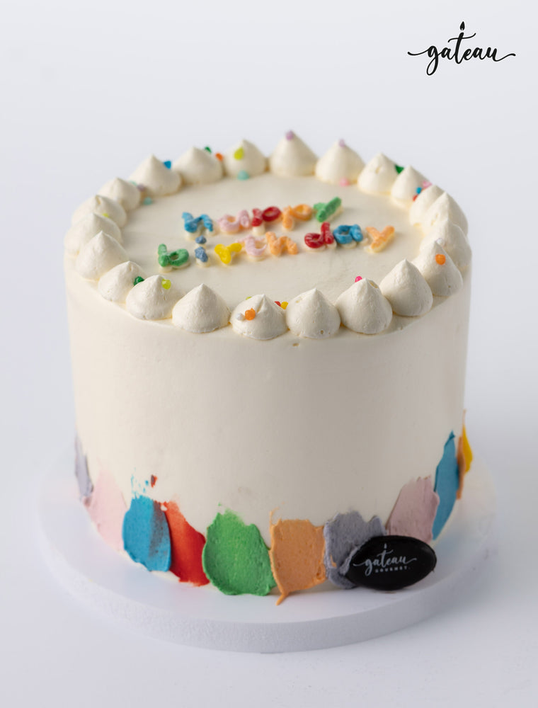Gateau Gourmet Cafe's birthday cake with colorful sprinkles, perfect for birthday cakes delivery