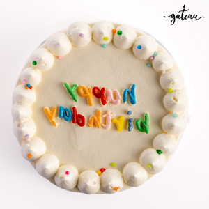 Delicious birthday cake with colorful frosting and sprinkles, perfect for birthday cakes delivery