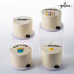 Gateau Gourmet Cafe birthday wish cake set with four simple white frosted cakes and colorful decorations