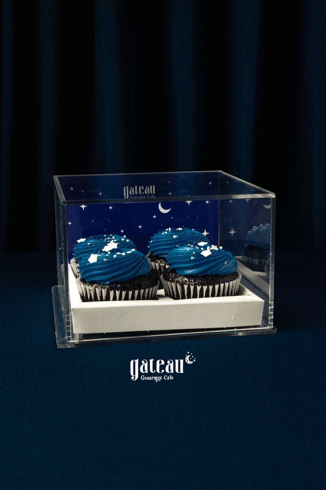 Blue frosted cupcakes for parties by Gateau Gourmet Cafe in clear star-themed display box