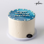 Blue ombre cake with white frosting and Happy Birthday Madilleen message from Gateau Gourmet Cafe