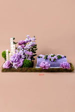 Lavender blueberry cake floral arrangement featuring fresh flowers and decorative elements