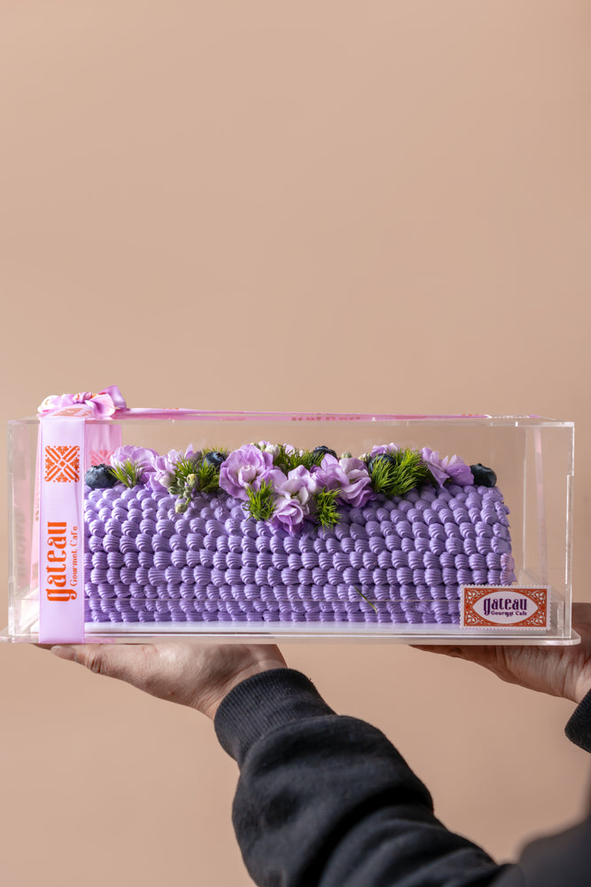 Gateau Gourmet Cafe blueberry cake floral arrangement with vibrant flowers and a textured purple design