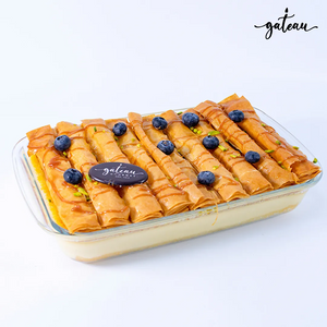 Blueberry Crème Brûlée dessert topped with blueberries and caramel drizzle by Gateau Gourmet Cafe
