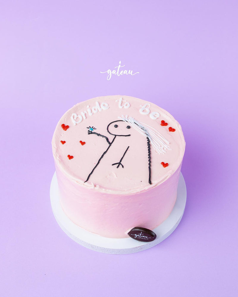 Pink bride to be cake with hand-drawn bride figure and red heart decorations from Gateau Gourmet Cafe