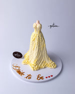 Bride to be cake shaped like a yellow gown with intricate icing details from Gateau Gourmet Cafe