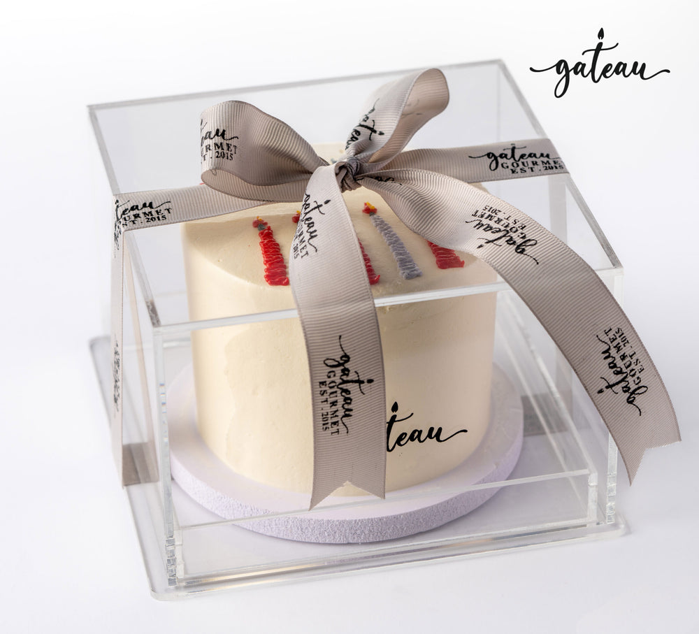 Gateau Gourmet Cafe candle bundle cake in clear box with decorative ribbon and logo on white background