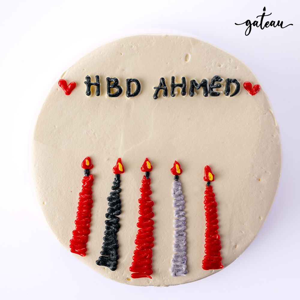 Gateau Gourmet Cafe candle bundle cake with red and black icing candles and HBD Ahmed message