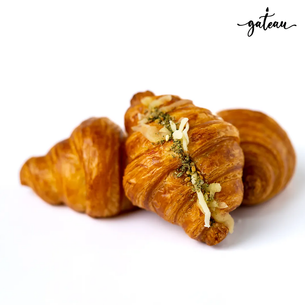 Gateau Gourmet Cafe cheese zaatar croissant with golden flaky crust and melted cheese on top