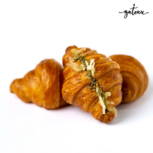 Gateau Gourmet Cafe cheese zaatar croissant with golden flaky crust and melted cheese on top