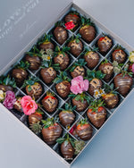 Gateau Gourmet Cafe chocolate covered strawberries with gold letter decorations and flowers in gift box