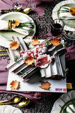 Festively decorated chocolate log cake from Gateau Gourmet Cafe with seasonal accents and elegant presentation