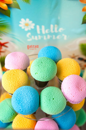 Colorful cupcakes for summer party with pastel blue yellow pink and green frosting from Gateau Gourmet Cafe