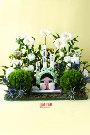 CRYBABY cake limited edition by Gateau Gourmet Cafe with intricate floral decorations and birthday candles