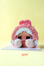 Pink and white CRYBABY character cake with expressive eyes and teardrops by Gateau Gourmet Cafe
