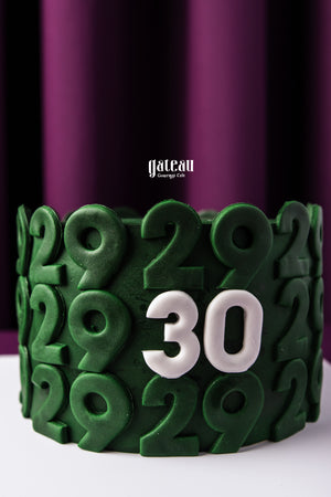 Gateau Gourmet Cafe custom birthday cake with green and white number decorations celebrating 30th birthday