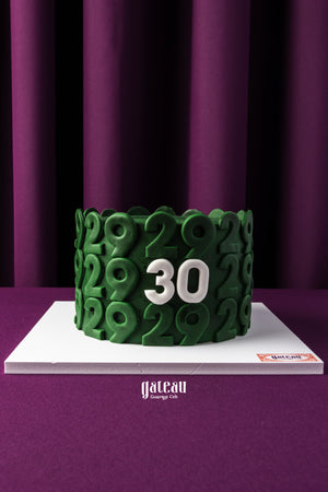 Gateau Gourmet Cafe custom birthday cake with green number 29 design and white number 30 centerpiece