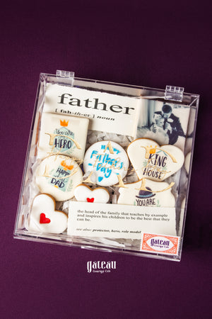 Custom Father's Day cookies decorated with messages and designs by Gateau Gourmet Cafe in clear gift box