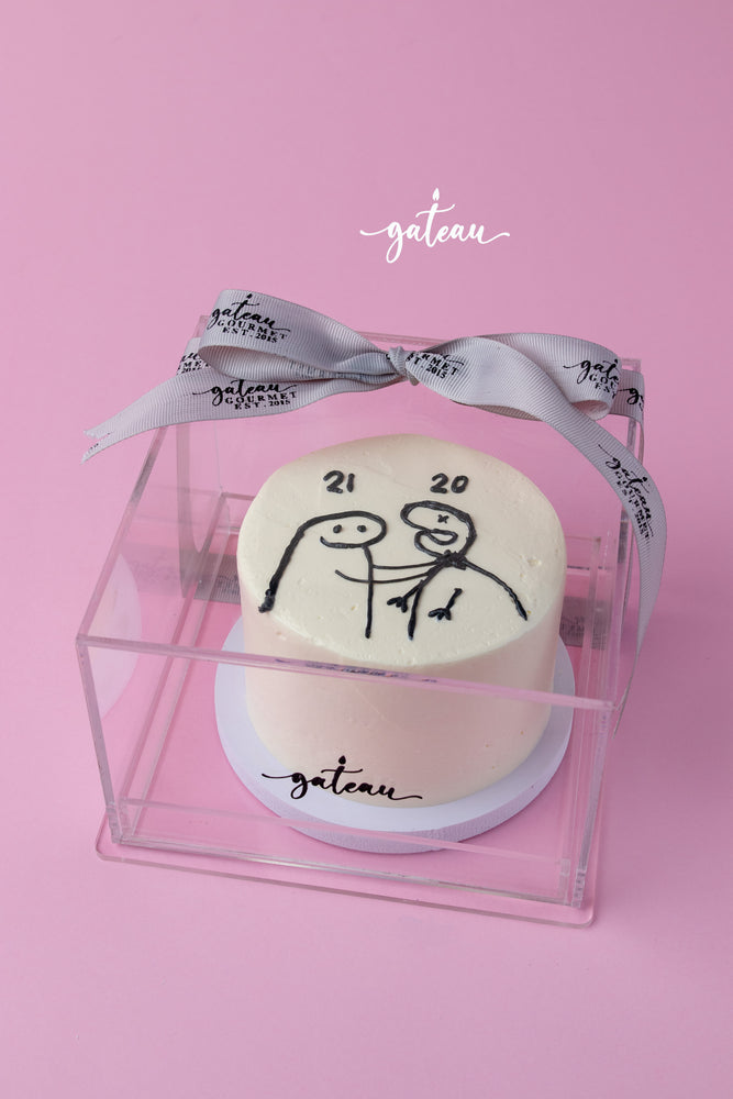 Custom flork cake by Gateau Gourmet Cafe with simple stick figure design in transparent gift box