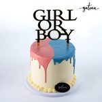 Gateau Gourmet Cafe custom gender reveal cakes with pink and blue dripping icing and girl or boy topper