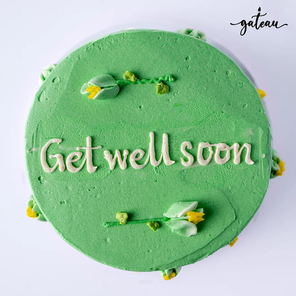 Green custom get well cakes with floral decorations and Get well soon message from Gateau Gourmet Cafe