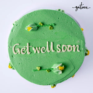 Green custom get well cakes with floral decorations and Get well soon message from Gateau Gourmet Cafe