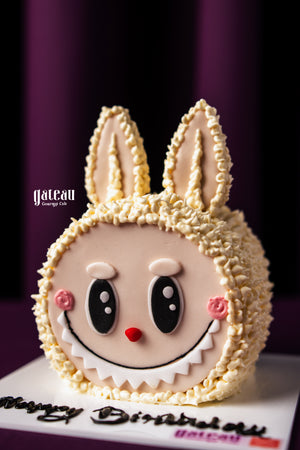 Custom labubu cake design featuring a playful bunny face with detailed frosting by Gateau Gourmet Cafe
