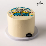 Gateau Gourmet Cafe custom minion birthday cake with smooth white frosting and Minion characters decoration