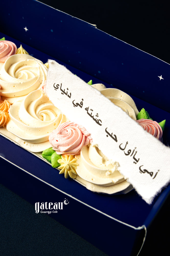 Gateau Gourmet Cafe custom Mother's Day cakes with creamy rose-shaped frosting and decorative flowers in a gift box