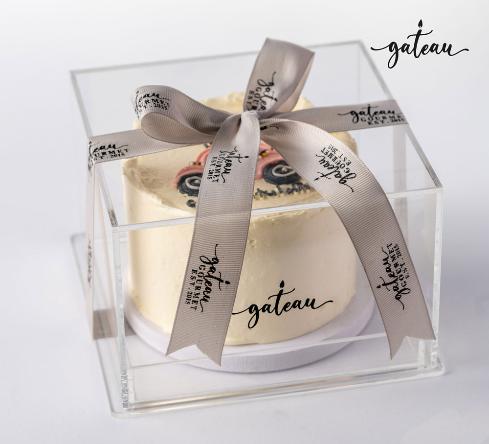 Custom new car cake beautifully presented in clear box with elegant ribbon by Gateau Gourmet Cafe