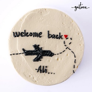 Customized Welcome Back Cake adorned with a plane design and heartfelt message for a special occasion