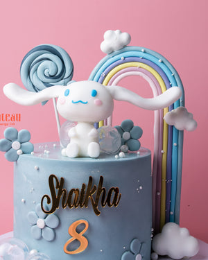 Cute character cake from Gateau Gourmet Cafe featuring a bunny, flowers, and rainbow for birthdays, cute character cakes near me.